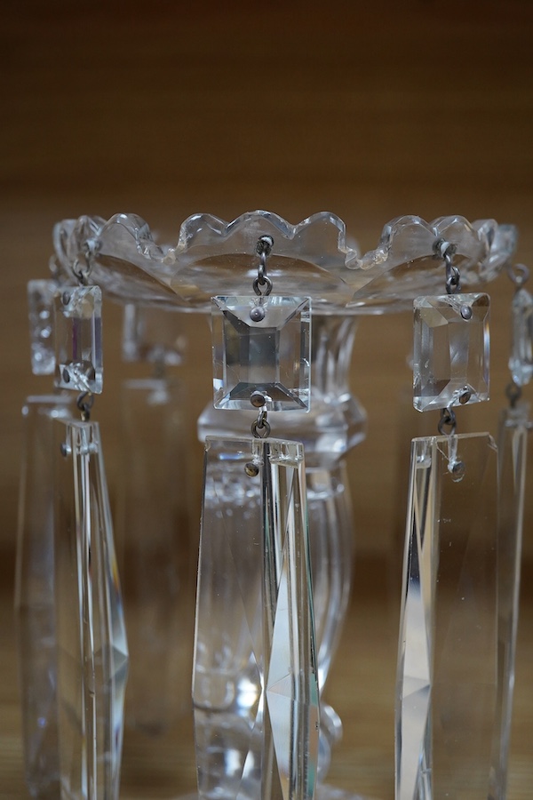 A pair of glass lustre drop candlesticks, 18cm high. Condition - fair to good